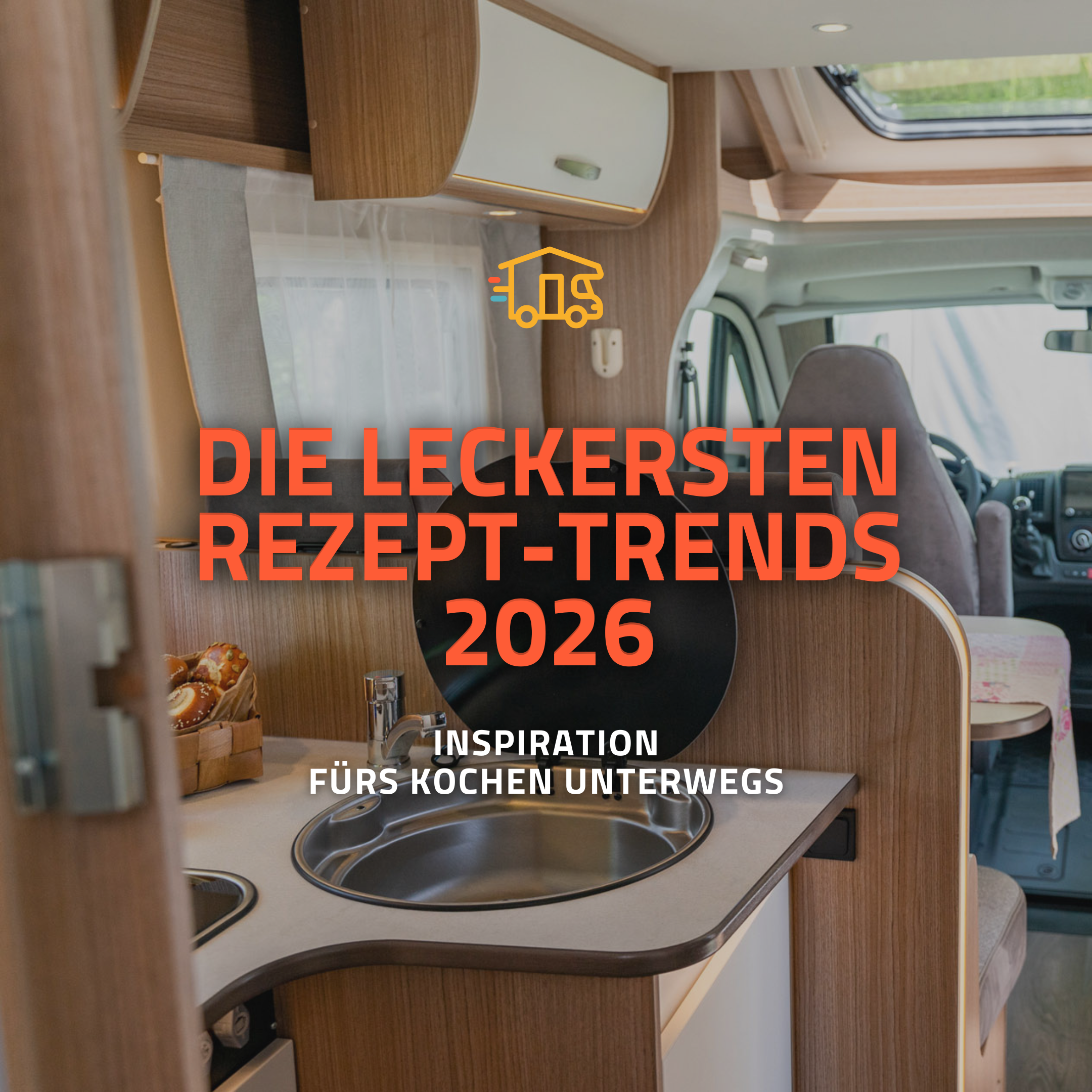 Bild von einer Wohnmobil-Küche mit Blick zum Cockpit